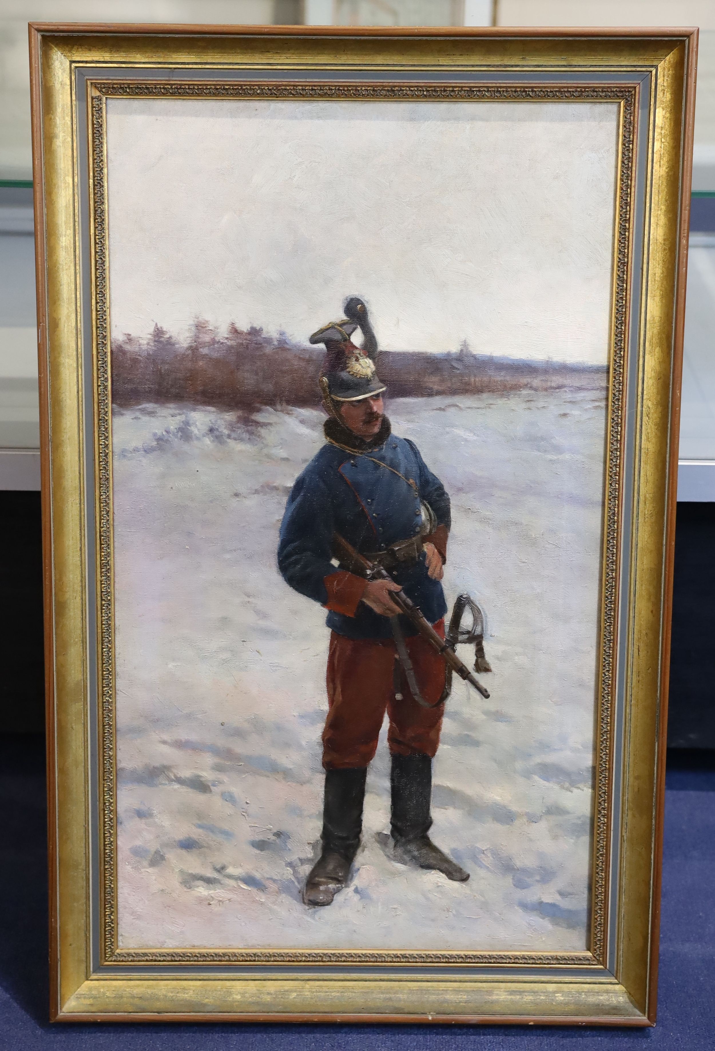 Austrian School c.1900, Soldier standing in the snow, oil on canvas, 73 x 42cm.